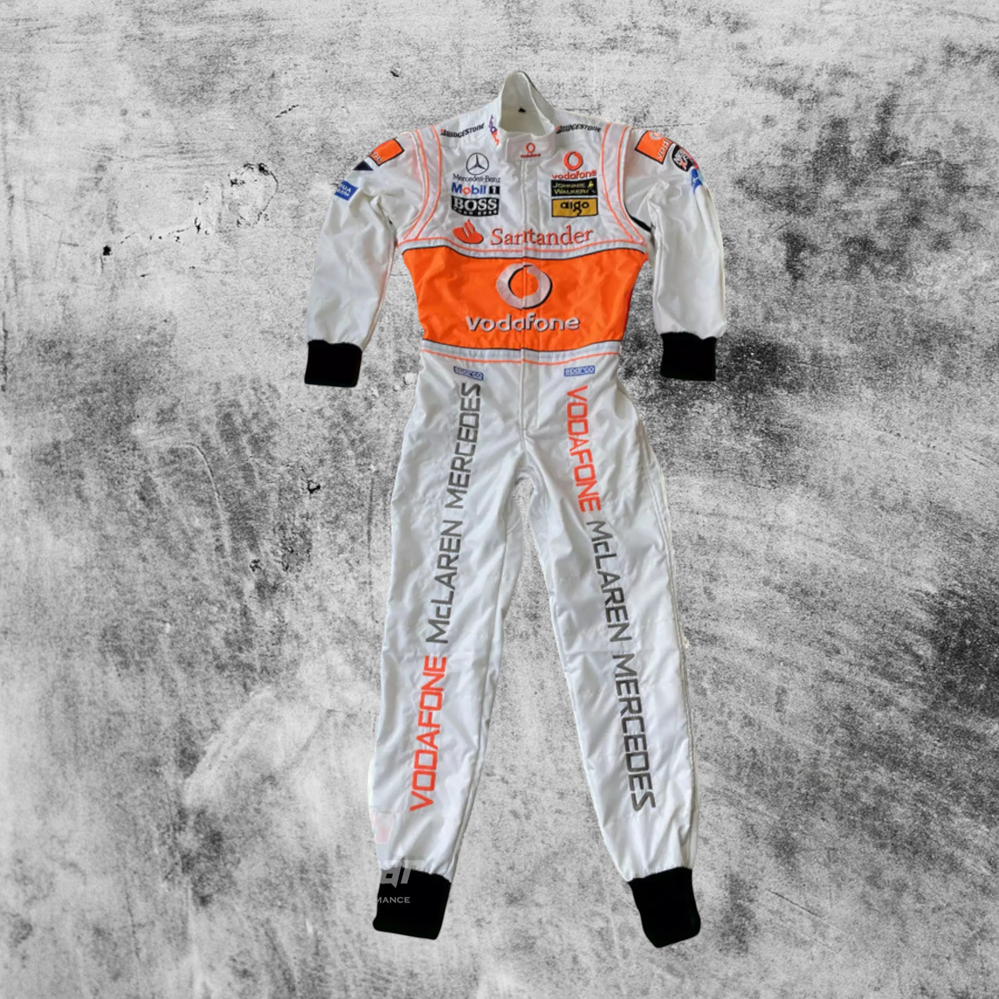 White racing suit with orange and black accents on a textured gray background